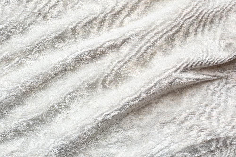 https://dreamlandmagazine.com.au/wp-content/uploads/2022/04/towel-fabric-texture-surface-close-up-background.jpg