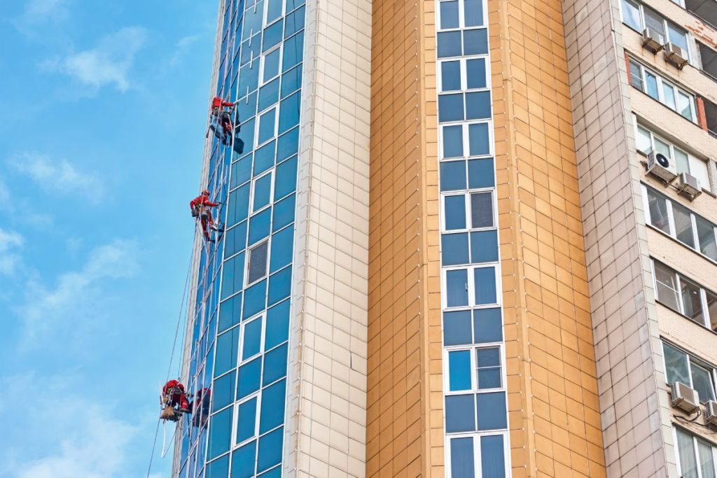 Group of industrial climber work on modern building outdoor